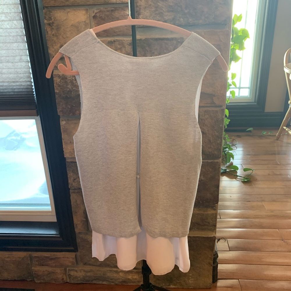 Sleeveless slightly metallic sweater.